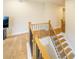 Close-up of a staircase with wooden railing and hardwood floors at 776 Clifftop Crossing, Powder Springs, GA 30127