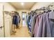 Large walk-in closet with ample hanging and shelving space at 776 Clifftop Crossing, Powder Springs, GA 30127