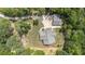 An aerial view of the home surrounded by lush trees and a circular driveway at 764 Little Vine Church Rd, Villa Rica, GA 30180