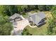 Aerial view of home with detached garage and extended driveway surrounded by a meticulously maintained lawn and landscaping at 764 Little Vine Church Rd, Villa Rica, GA 30180