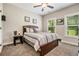 Cozy bedroom with neutral colors, carpet, and windows overlooking the yard at 764 Little Vine Church Rd, Villa Rica, GA 30180