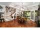 Dining room featuring wood floors, stylish lighting, and access to sunroom at 764 Little Vine Church Rd, Villa Rica, GA 30180
