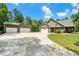 Exterior view of the house featuring a long driveway and a three-car detached garage at 764 Little Vine Church Rd, Villa Rica, GA 30180