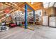 Spacious garage interior with car lift, well-organized tools, and plenty of storage space at 764 Little Vine Church Rd, Villa Rica, GA 30180