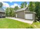 Two-car detached garage features a side door and is connected to the main house with a fenced-in walkway at 764 Little Vine Church Rd, Villa Rica, GA 30180