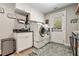 Well-organized laundry room featuring modern appliances, ample cabinet space, and stylish design at 764 Little Vine Church Rd, Villa Rica, GA 30180