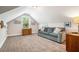 Cozy living room featuring vaulted ceilings, neutral decor, and a comfortable couch at 764 Little Vine Church Rd, Villa Rica, GA 30180