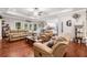 Open living room with hardwood floors and plenty of seating at 764 Little Vine Church Rd, Villa Rica, GA 30180