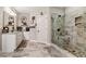Modern main bathroom with granite counters, double sinks, and walk-in shower featuring decorative tile at 764 Little Vine Church Rd, Villa Rica, GA 30180