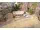House nestled on a wooded lot with a long private drive at 1036 Wooten Lake Nw Rd, Kennesaw, GA 30144