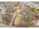 Overview of property, showing house, woods and creek at 1036 Wooten Lake Nw Rd, Kennesaw, GA 30144