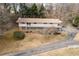 Two-story home with a private drive and wooded lot at 1036 Wooten Lake Nw Rd, Kennesaw, GA 30144