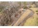 House and property with long driveway near wooded area at 1036 Wooten Lake Nw Rd, Kennesaw, GA 30144