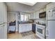 Efficient kitchen with white cabinets and modern appliances at 1036 Wooten Lake Nw Rd, Kennesaw, GA 30144