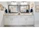 Bathroom featuring a double vanity and granite countertop at 1018 Cherry Bark Ln, Loganville, GA 30096
