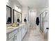 Elegant bathroom with double vanity, granite countertop, and a large shower at 1018 Cherry Bark Ln, Loganville, GA 30096