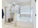 Spa-like bathroom with soaking tub and walk-in shower at 1018 Cherry Bark Ln, Loganville, GA 30096