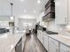 Modern kitchen with stainless steel appliances and ample counter space at 1018 Cherry Bark Ln, Loganville, GA 30096