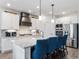Modern kitchen with stainless steel appliances and large island at 1018 Cherry Bark Ln, Loganville, GA 30096