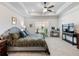 Main bedroom with large bed, TV and plenty of space at 1018 Cherry Bark Ln, Loganville, GA 30096