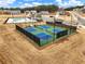 Enjoy community pickleball courts with surrounding homes and pool in view at 1018 Cherry Bark Ln, Loganville, GA 30096
