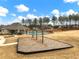 Community playground with swings near pool and clubhouse at 1018 Cherry Bark Ln, Loganville, GA 30096