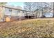 A view of the home's backyard with a wooden deck at 5925 S Quail Dr, Douglasville, GA 30135
