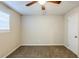 Bedroom featuring neutral walls, brown carpet, a ceiling fan and a window at 5925 S Quail Dr, Douglasville, GA 30135
