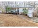 Charming single-story home with a cozy front porch and well-maintained lawn and landscaping at 5925 S Quail Dr, Douglasville, GA 30135