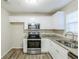 Inviting kitchen space with modern appliances, granite countertops, and plenty of natural light at 5925 S Quail Dr, Douglasville, GA 30135