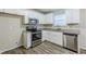 Bright kitchen featuring white cabinetry, stainless steel appliances, and durable countertops at 5925 S Quail Dr, Douglasville, GA 30135