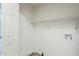 Laundry room with white walls, shelving, and washer/dryer hookups at 5925 S Quail Dr, Douglasville, GA 30135