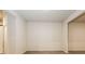 Unfinished basement featuring light gray flooring and freshly painted walls at 148 Oliver Dr, Locust Grove, GA 30248