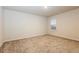 Cozy bedroom featuring neutral carpet and ample natural light from a large window at 148 Oliver Dr, Locust Grove, GA 30248