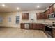 Bright kitchen with stainless steel appliances, granite countertops, and wood-look floors at 148 Oliver Dr, Locust Grove, GA 30248