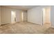 Large main bedroom with carpeted floors, walk-in closet, and ensuite bathroom at 148 Oliver Dr, Locust Grove, GA 30248