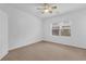 Well-lit bedroom with ceiling fan and window at 2251 W Village Ln, Smyrna, GA 30080