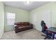 Guest bedroom with brown couch and gaming chair at 38 Rocky Knl, Dallas, GA 30157