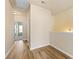 Upstairs hallway with light colored walls and vinyl flooring at 38 Rocky Knl, Dallas, GA 30157
