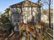 View of backyard with a wooden deck, stairs, and outdoor seating area, perfect for relaxing or entertaining guests at 5712 Overlook Cir, Powder Springs, GA 30127