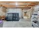 Spacious unfinished basement with visible ceiling beams offering future expansion at 5712 Overlook Cir, Powder Springs, GA 30127