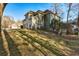 Two-story home featuring a two-car garage and a well-maintained lawn, set against a clear blue sky at 5712 Overlook Cir, Powder Springs, GA 30127