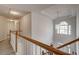 Upstairs hallway with a view to the second floor and a large window at 5712 Overlook Cir, Powder Springs, GA 30127