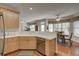 View from kitchen into the breakfast nook with dining table and natural light at 5712 Overlook Cir, Powder Springs, GA 30127