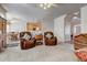 Spacious living room with leather recliners and a view into the kitchen at 5712 Overlook Cir, Powder Springs, GA 30127