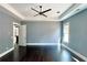 Spacious bedroom with dark hardwood floors and ceiling fan at 300 Eminence Peak, Rydal, GA 30171