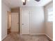 Bright bedroom with neutral walls, carpet, and ample closet space at 404 Utoy Sw Cir, Atlanta, GA 30331