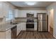 Modern kitchen with stainless steel appliances and granite countertops at 404 Utoy Sw Cir, Atlanta, GA 30331