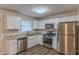 Modern kitchen with stainless steel appliances and granite countertops at 404 Utoy Sw Cir, Atlanta, GA 30331