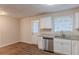 Modern kitchen with stainless steel appliances and granite countertops at 404 Utoy Sw Cir, Atlanta, GA 30331